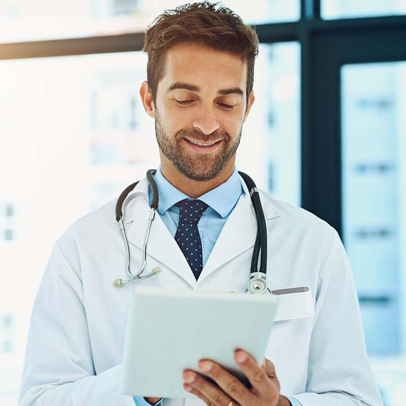 Doctor reviewing a tablet with patient information