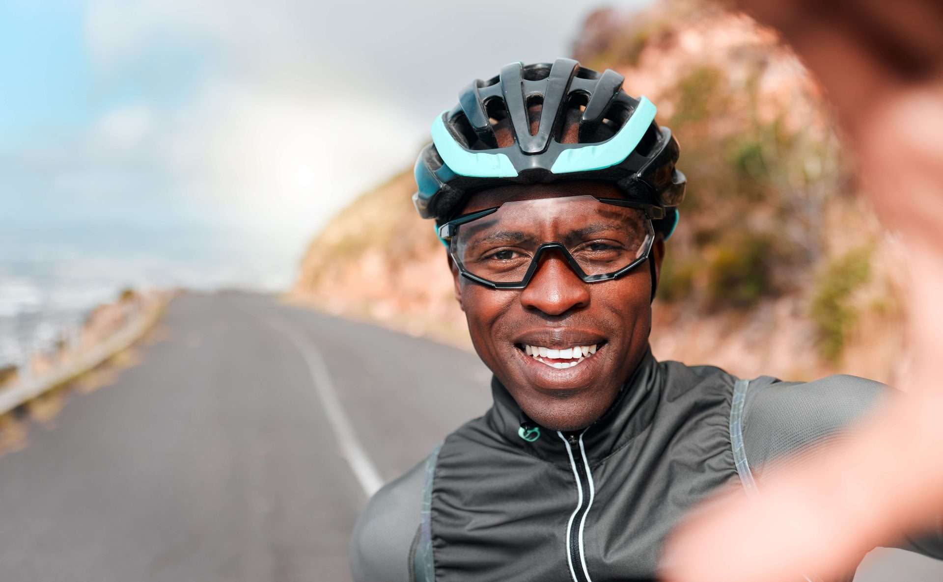 A man wearing a bike helmet and goggles