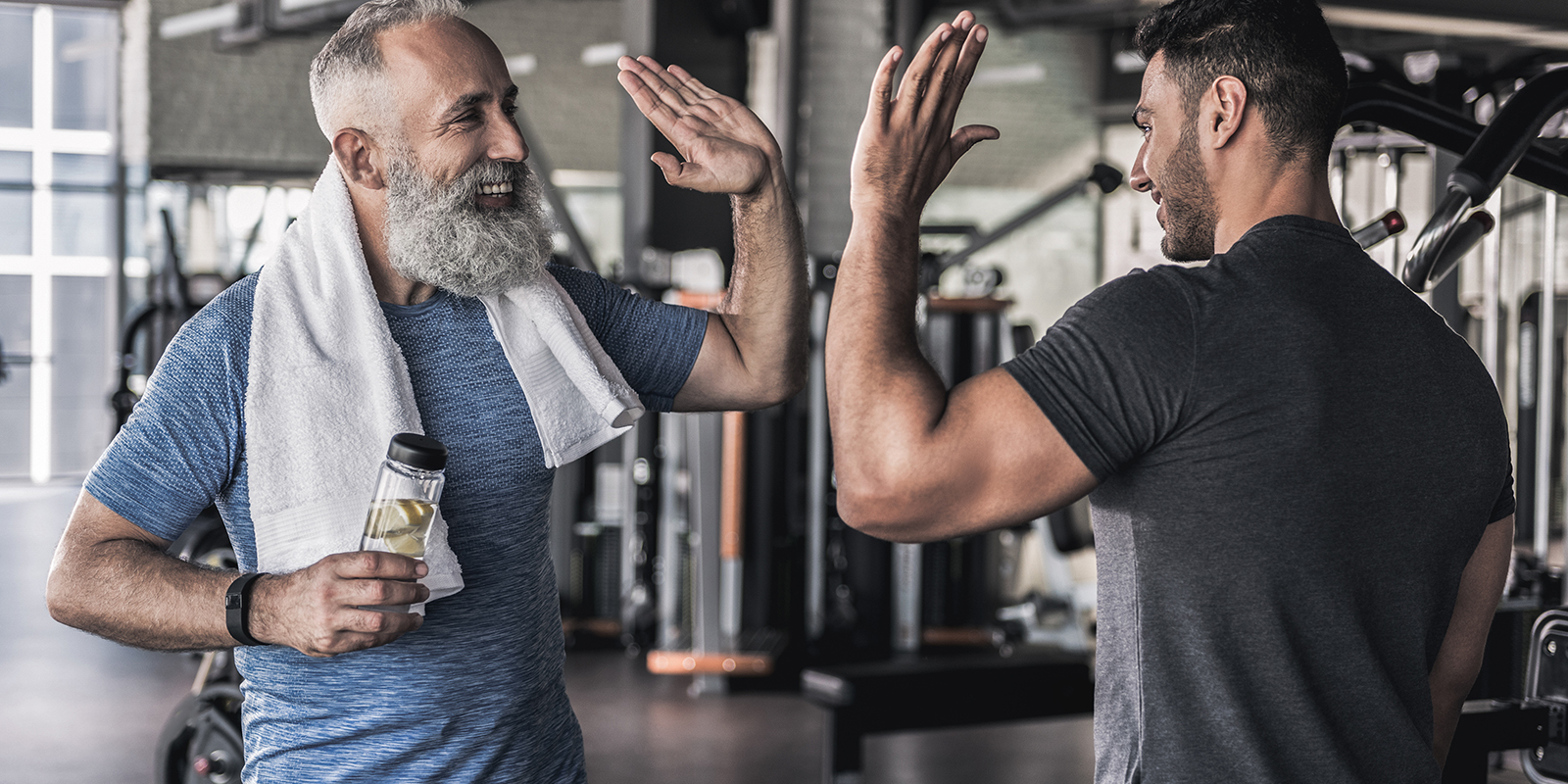 Guy in gym wearing headphones